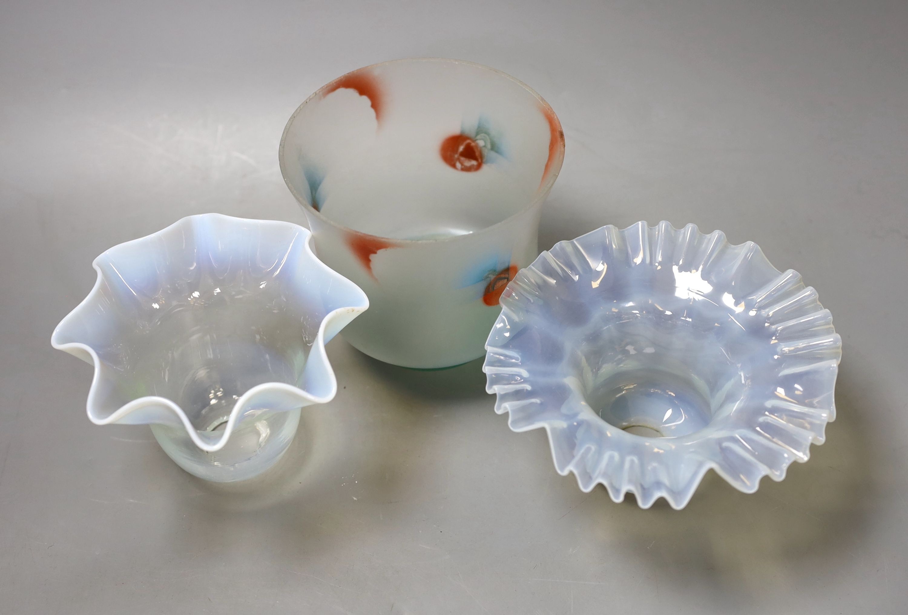 A pair of opalescent glass light shades, and a coloured light shade